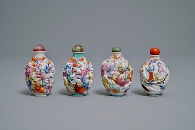 Four Chinese famille rose porcelain relief-decorated snuff bottles, 19th C.